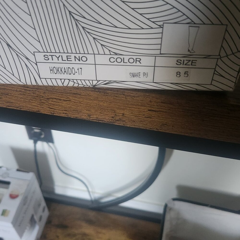 Thigh high boots. Snake